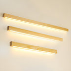 Applique lineare in legno con luce sottile