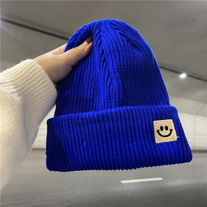Berretto a maglia morbido con patch smile