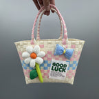 Borsa a mano giocosa con fiore e fiocco
