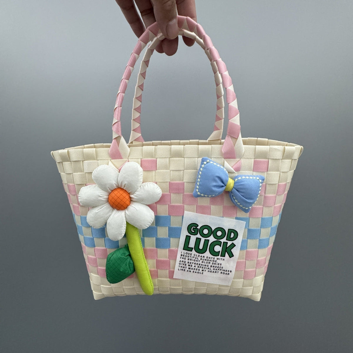 Borsa a mano giocosa con fiore e fiocco