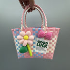 Borsa a mano giocosa con fiore e fiocco