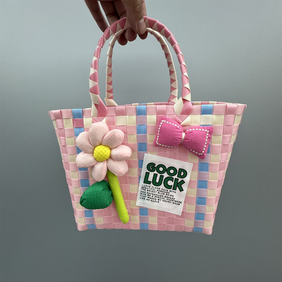 Borsa a mano giocosa con fiore e fiocco