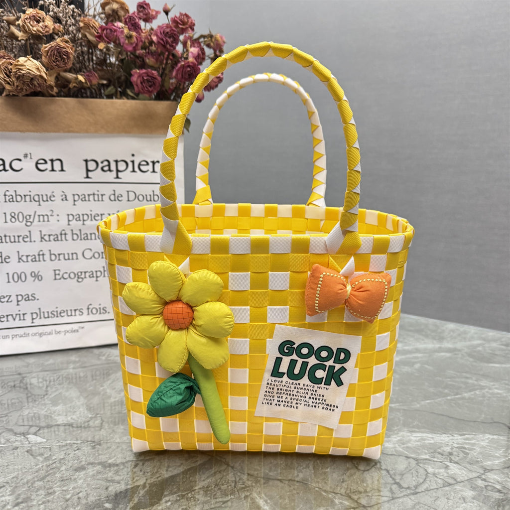 Borsa a mano giocosa con fiore e fiocco