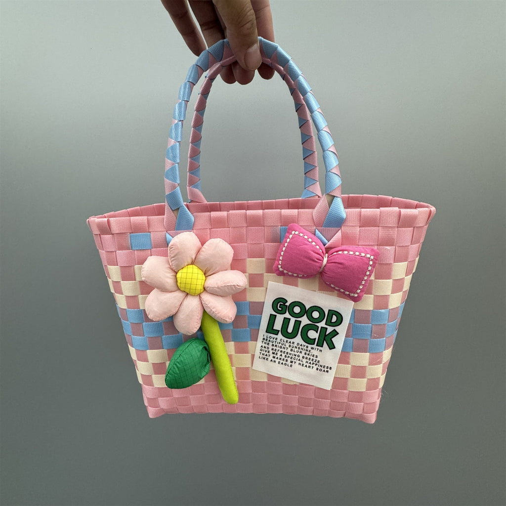 Borsa a mano giocosa con fiore e fiocco
