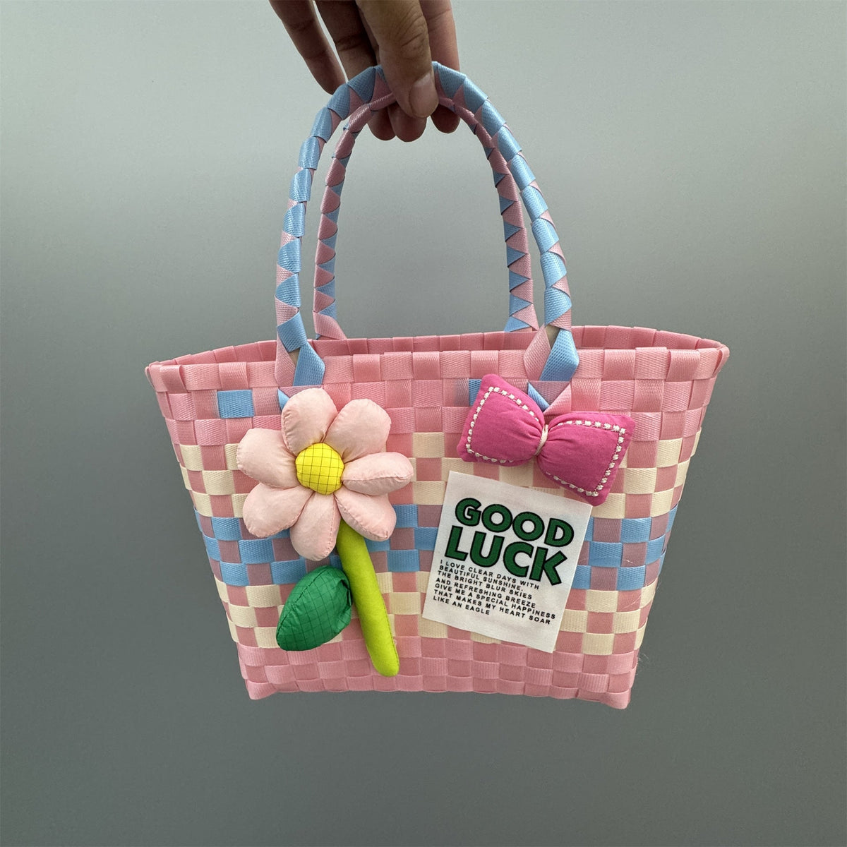 Borsa a mano giocosa con fiore e fiocco