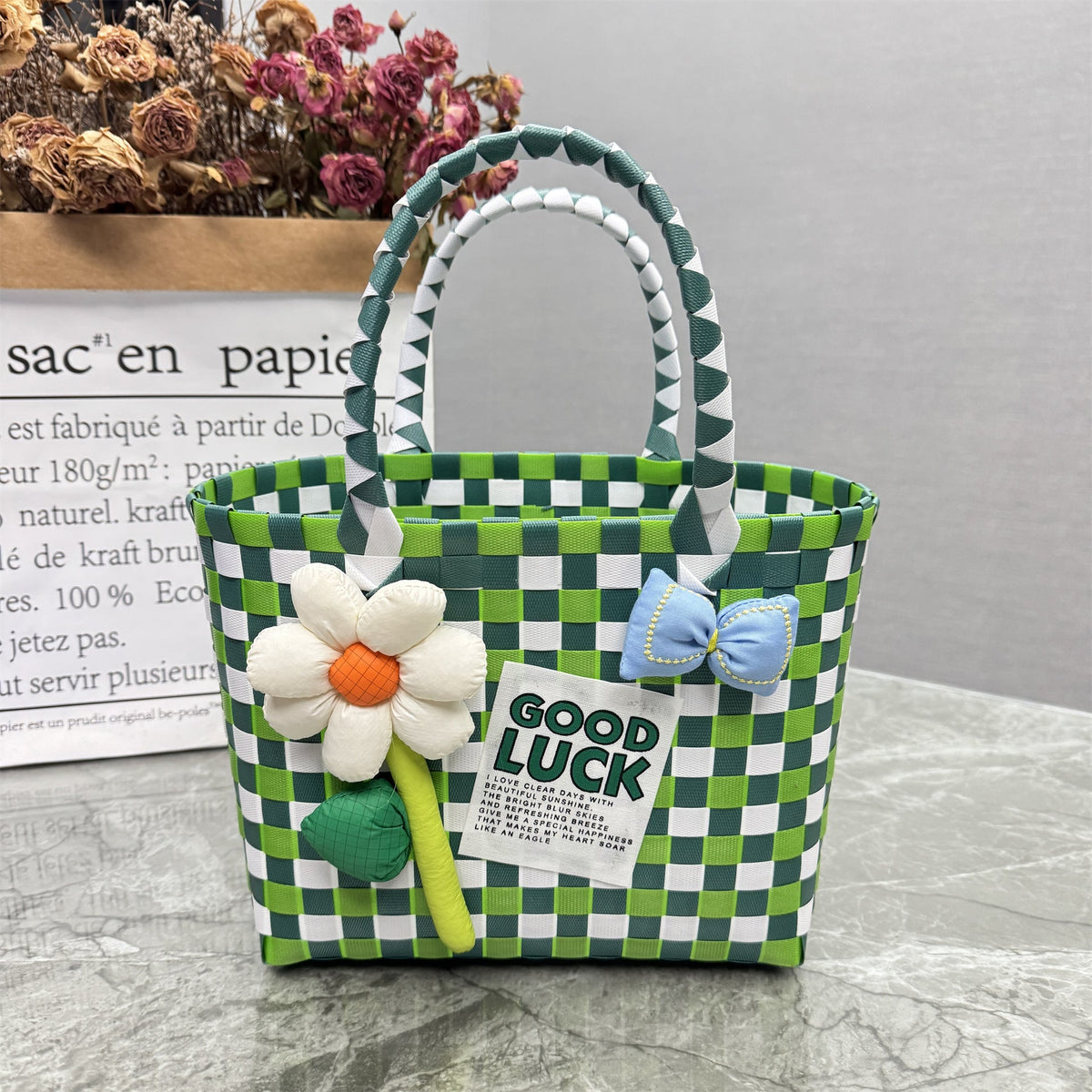 Borsa a mano giocosa con fiore e fiocco