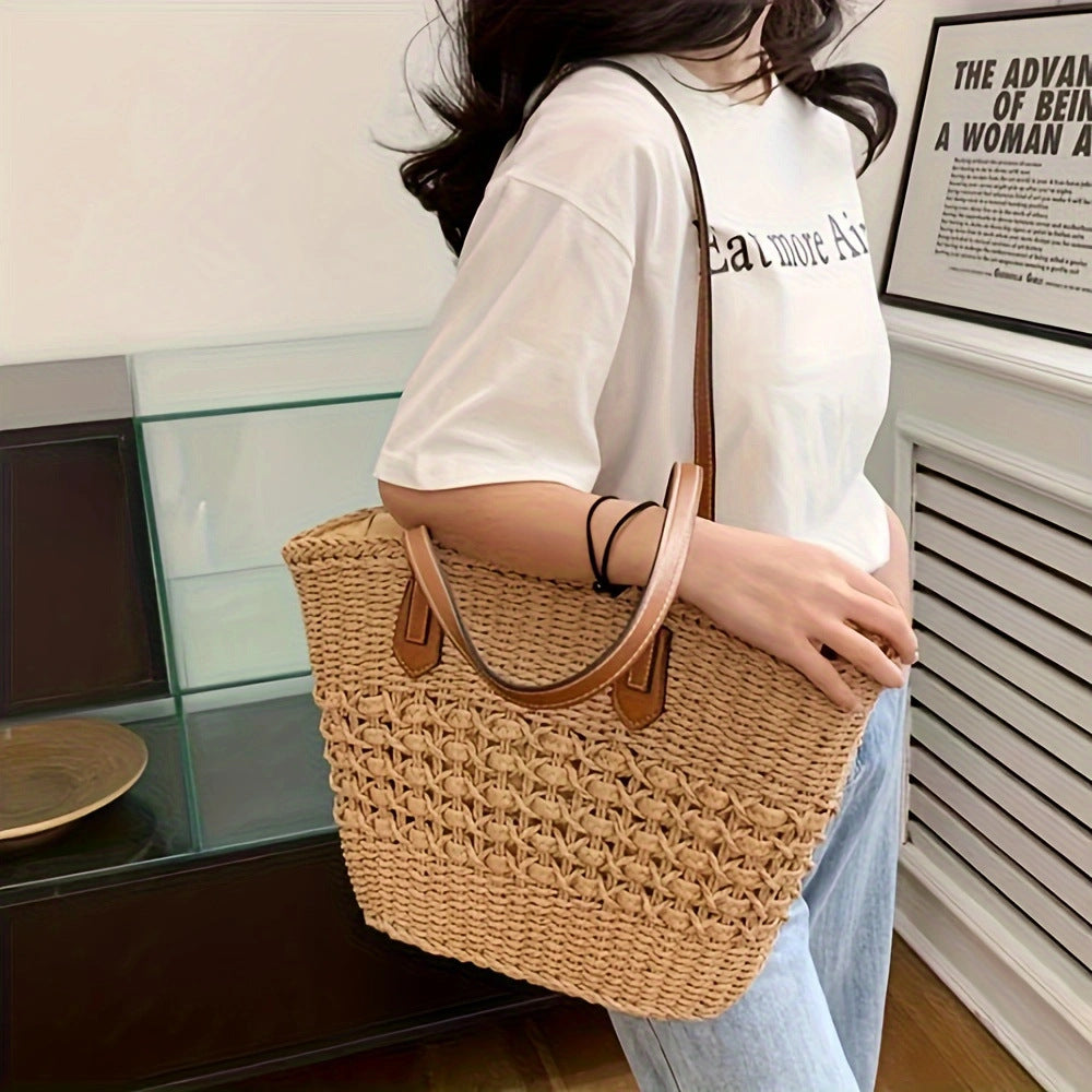 Borsa intrecciata con manici in pelle