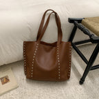 Borsa tote in pelle con borchie