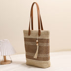 Borsa tote intrecciata in materiali naturali