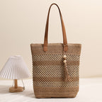 Borsa tote intrecciata in materiali naturali