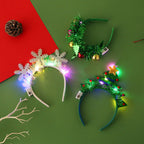 Cerchietto natalizio luminoso con luci LED – albero, fiocco di neve, corna di renna