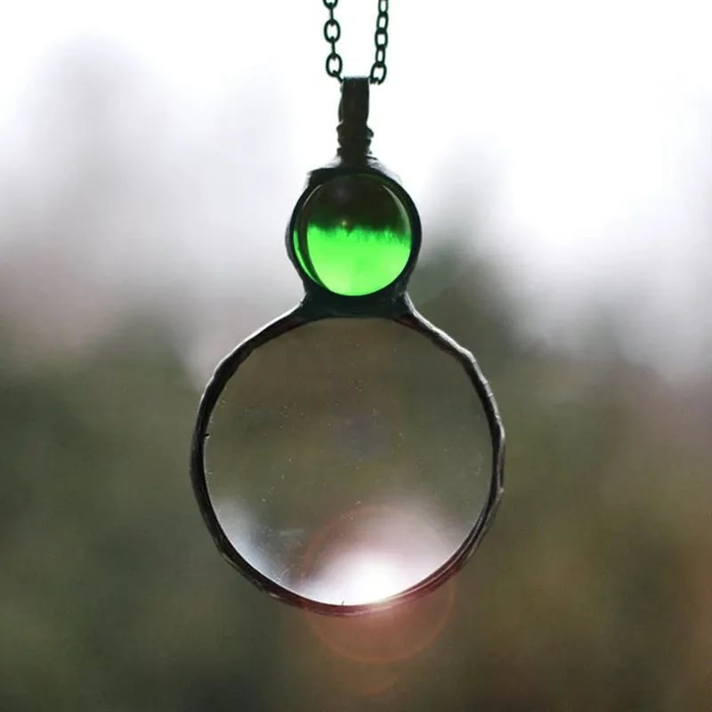 Collana con ciondolo lente d'ingrandimento