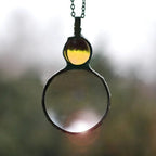 Collana con ciondolo lente d'ingrandimento