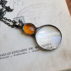 Collana con ciondolo lente d'ingrandimento