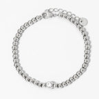 Collana e bracciale con perline e diamante centrale 18k