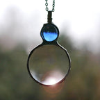 Collana elegante con ciondolo lente d'ingrandimento