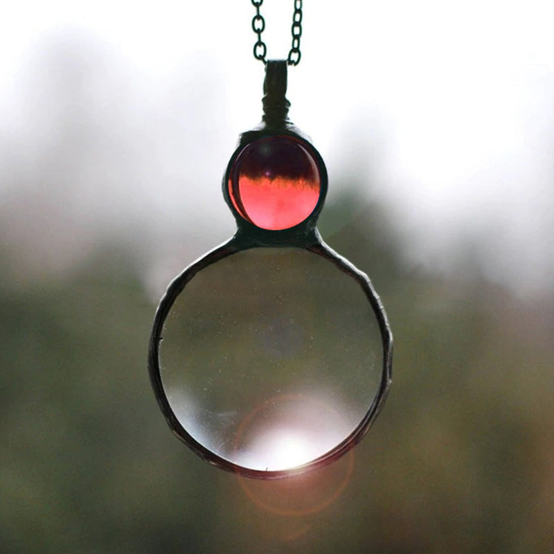 Collana elegante con ciondolo lente d'ingrandimento