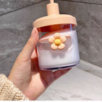 Contenitore decorativo in vetro con fiore