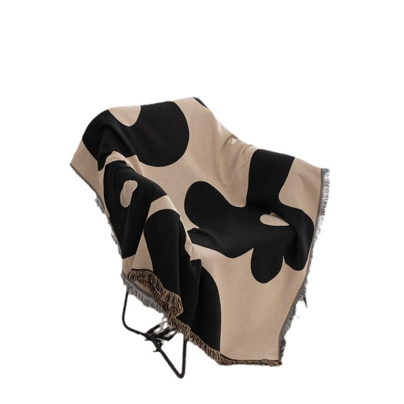 Coperta decorativa in tessuto morbido con motivo geometrico