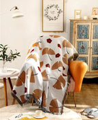 Coperta decorativa in tessuto morbido con motivo geometrico