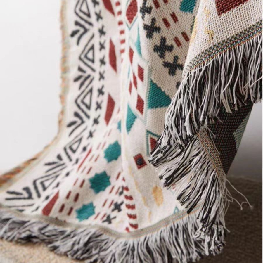 Coperta decorativa in tessuto morbido con motivo geometrico