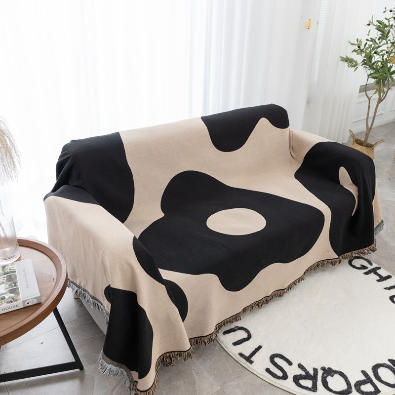 Coperta decorativa in tessuto morbido con motivo geometrico