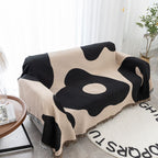 Coperta decorativa in tessuto morbido con motivo geometrico