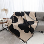 Coperta decorativa in tessuto morbido con motivo geometrico