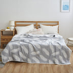 Coperta elegante con delicato motivo a foglie