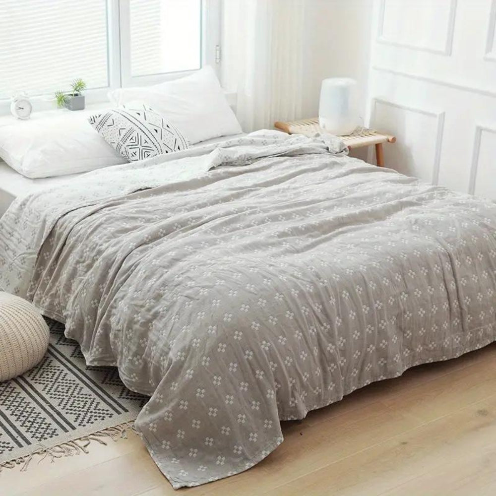 Coperta in cotone con motivo geometrico