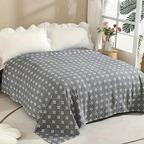 Coperta in cotone con motivo geometrico