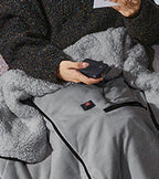 Coperta riscaldata da donna