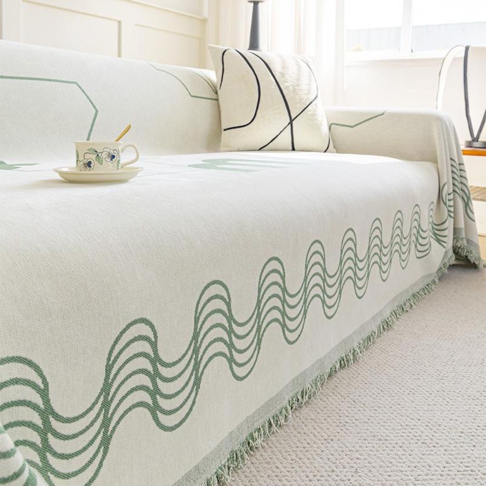 Copridivano a onde curve con frange decorative
