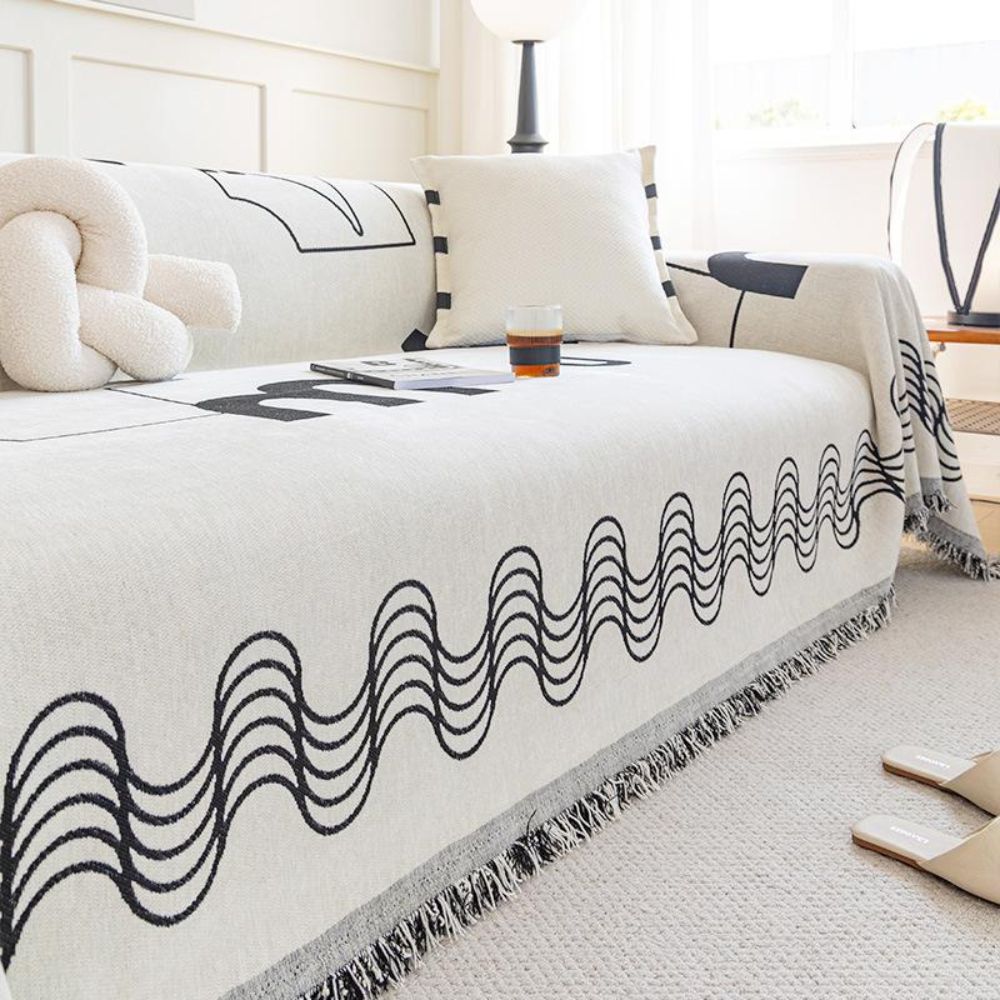 Copridivano a onde curve con frange decorative