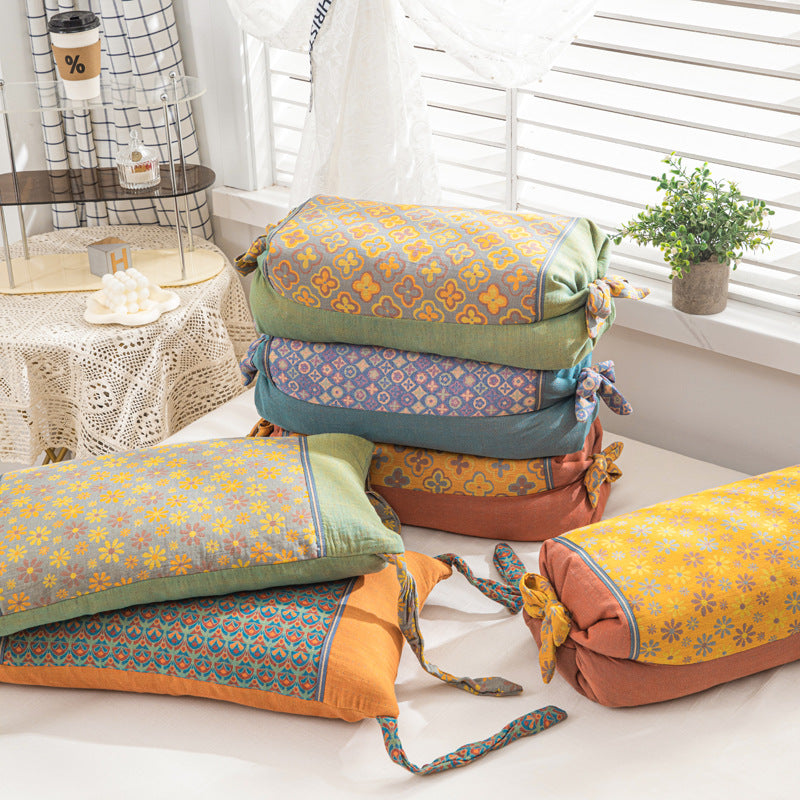 Cuscino cilindrico decorativo con motivo floreale