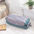 Cuscino cilindrico decorativo con motivo floreale