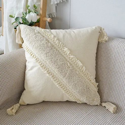 Cuscino decorativo con trama in rilievo e frange