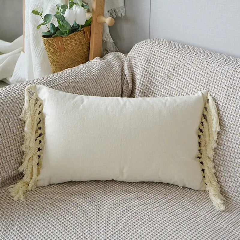 Cuscino decorativo con trama in rilievo e frange