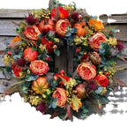 Ghirlanda autunnale con zucche e fiori