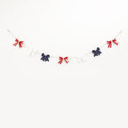 Ghirlanda decorativa unisex con fiocchi a righe e cordino in juta