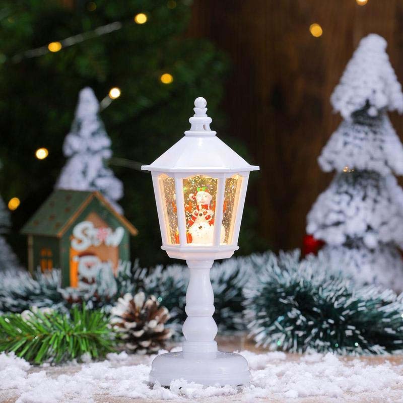 Lanterna natalizia con neve e luci decorative