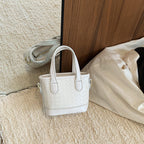 Mini borsa intrecciata con charm