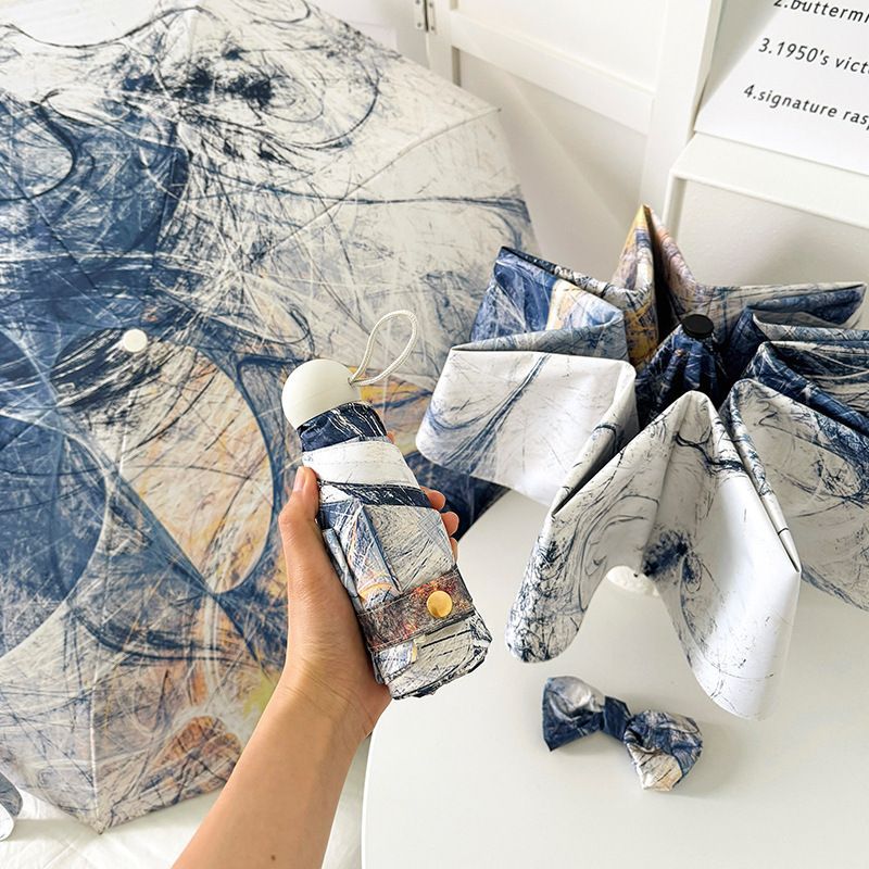 Ombrello pieghevole da donna con motivo artistico e apertura automatica