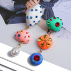 Orecchini boho artistici asimmetrici