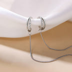 Orecchini con catena dal design unico