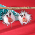 Orecchini natalizi con pon pon e fiocchi di neve