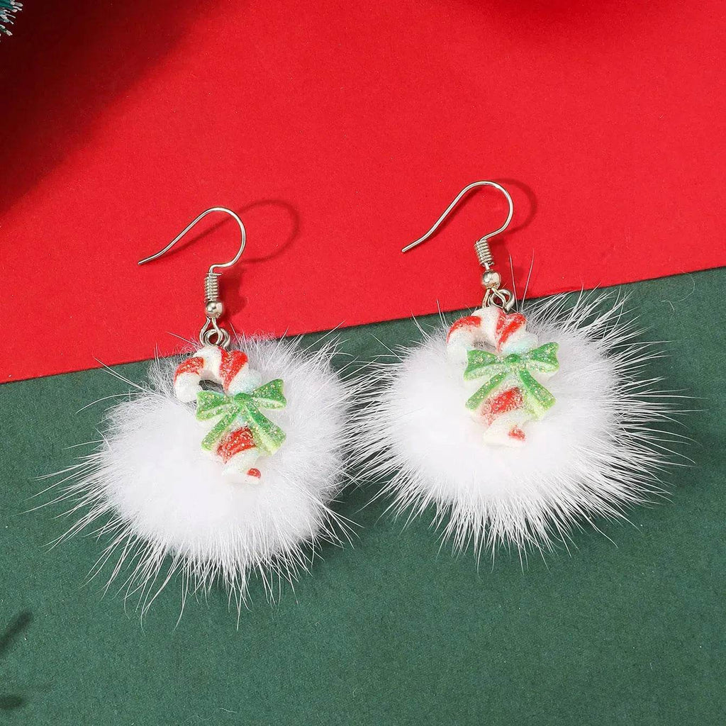 Orecchini natalizi con pon pon e fiocchi di neve