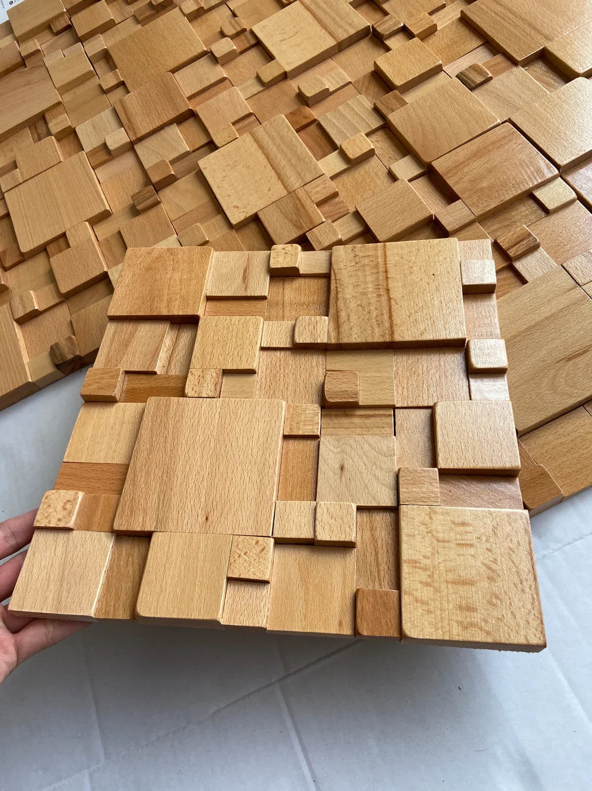 Pannelli acustici a mosaico in legno massello di faggio e noce