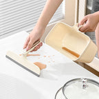 Raschietto raccogli-scarti con contenitore integrato 2 in 1