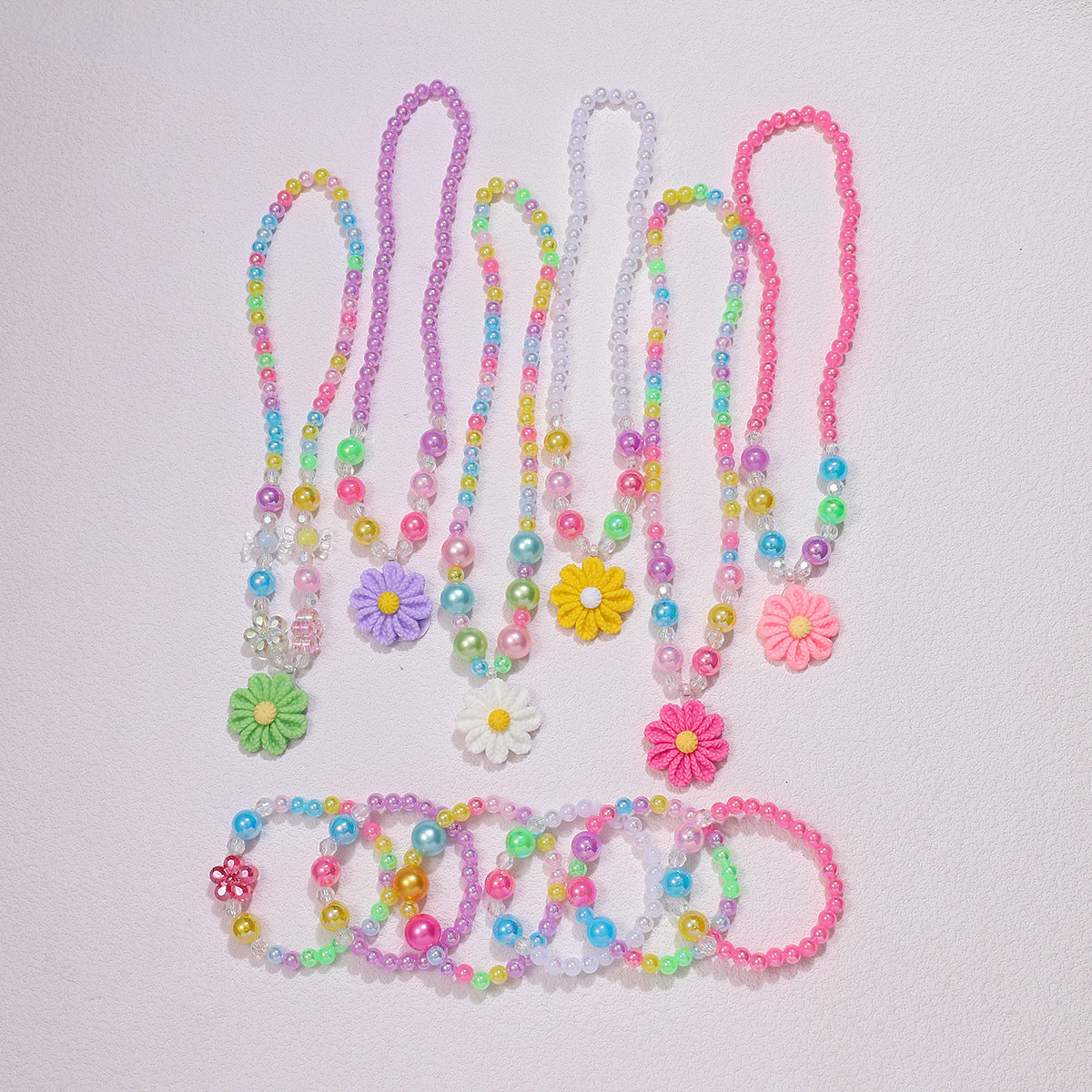 Set di gioielli giocosi con ciondolo a fiore